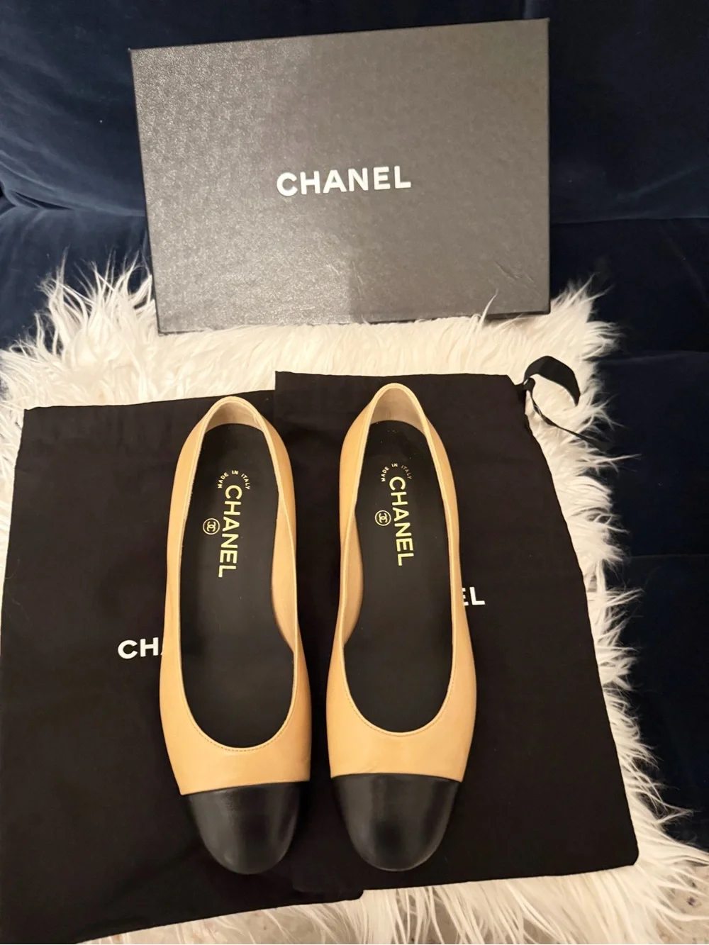 CHANEL Tan Leather Ballet Flats with Black Cap Toe and Pearl Heel Trim